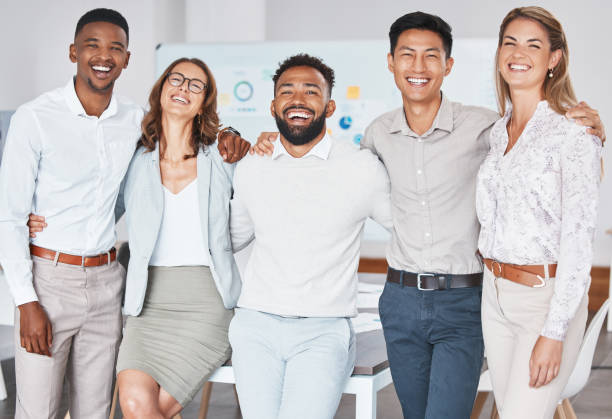 istock Business people, diversity and teamwork collaboration with success, pride and motivation vision in marketing startup. Portrait, smile and happy men and women for about us in advertising office company 1441356330