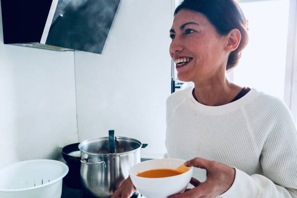 istock Woman cooking 1441356678