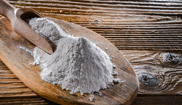 istock Wheat flour on the wooden cutting board 1441357212