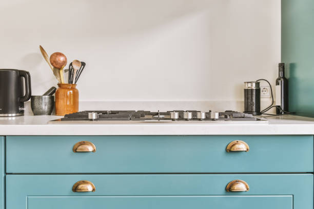 istock Modern bright kitchen in a cozy house with blue cabinets 1441361090