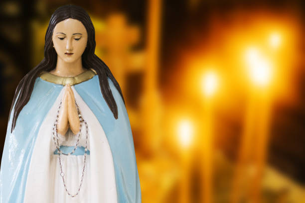 istock Mother Mary pray. Blessed virgin statue. Praying Virgin Mary statue. Religious background. Empty copy space faith background. 1441361484