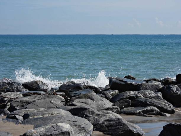 istock Crashing waves against rocks on a Florida beach 1441361570