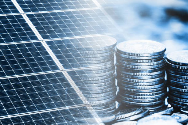 istock Coins stacked saving money. Solar panel texture. Environmental technology. Blue eco power supply background. Electrical cell generating current. 1441362228