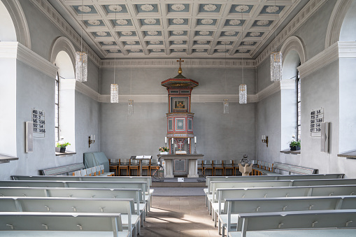Kürten, Germany - February 13, 2022: View throught the main aisle of the Delling church on February 13, 2022 in Kuerten, Bergisches Land, Germany