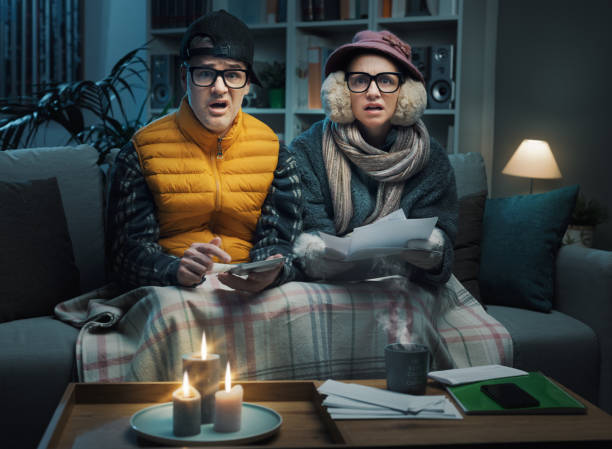 istock Desperate couple checking bills at home 1441363178