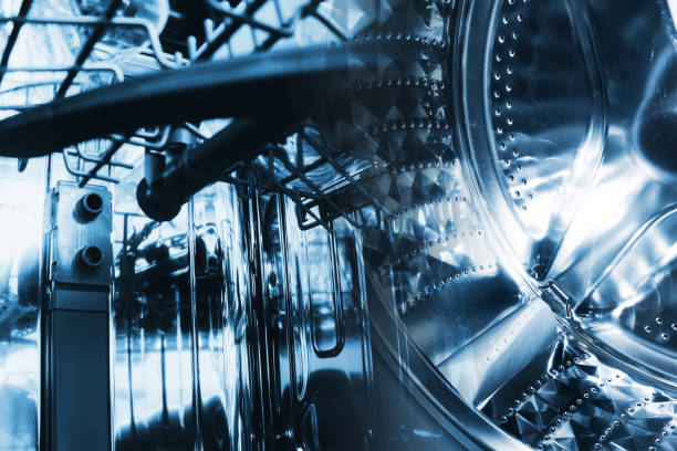 istock Washing machine background. Inside the washing machine. Metal washing machine drum. Inside empty dish washer background. 1441363224