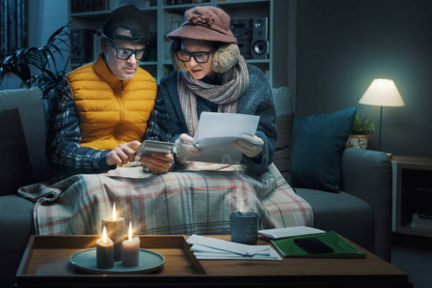 istock Desperate couple checking bills at home 1441363379