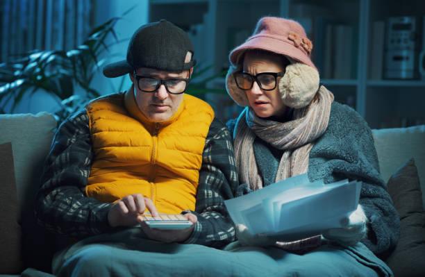 istock Desperate couple checking bills at home 1441363601