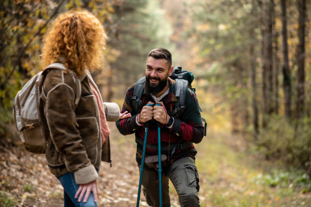 istock Lovely romantic couple hiking through the woods 1441364211