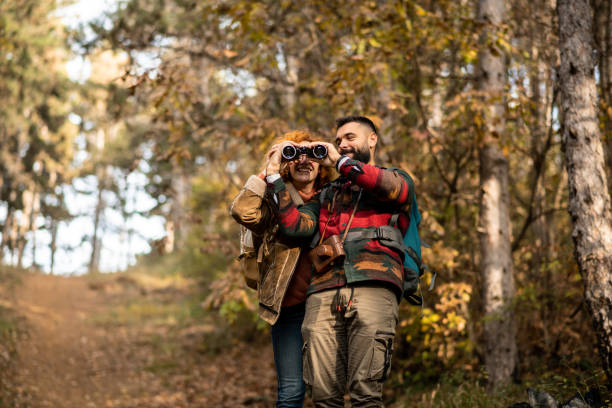 istock Hiker showing something to his girlfriend through the binoculars 1441364579