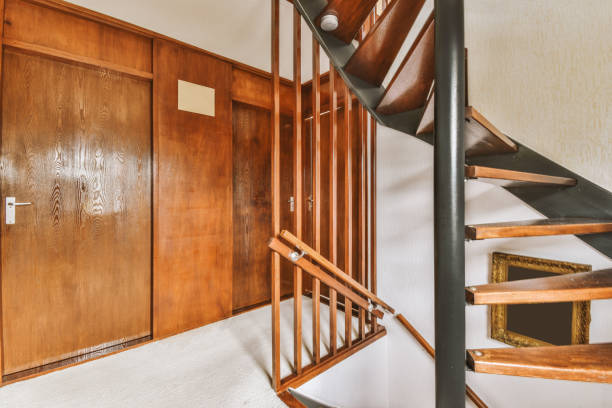 istock Spacious bright corridor with a spiral wooden staircase 1441365464