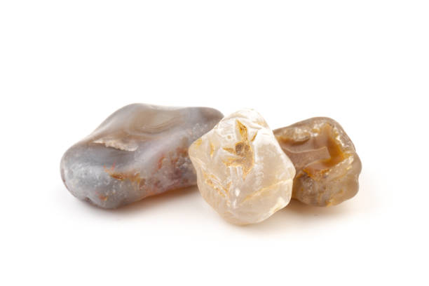 istock Multicolored gemstones, tumbled minerals. Bostwan agate of various sizes on a white background. 1441366526