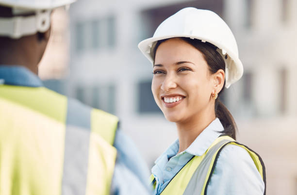 istock Building engineer, construction worker or engineering woman with smile, motivation or property vision for real estate architecture. Happy development employee or leader in site teamwork collaboration 1441366882