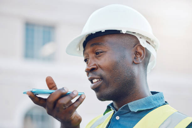 istock Communication, safety and a construction worker on phone call or sending voice note. A black man, engineer or builder on mobile at building site. Contractor working and talking on smartphone outdoors 1441366895