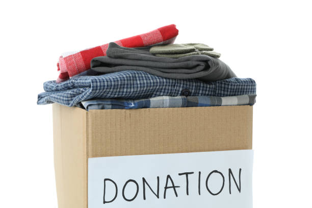 istock Donation box with clothes isolated on white background 1441367807