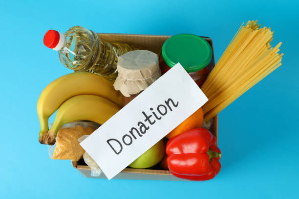 istock Concept of donate with donation box on blue background 1441367892