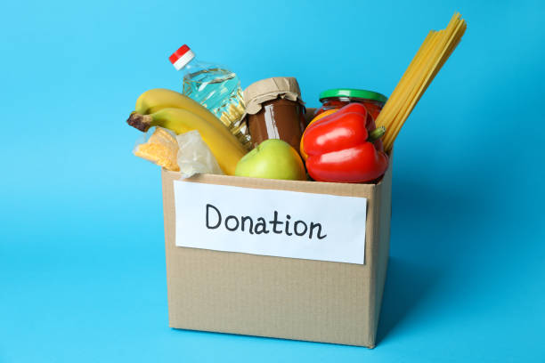 istock Concept of donate with donation box on blue background 1441368658
