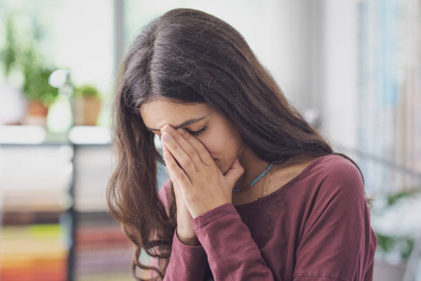 istock Stressed sad woman posing indoors 1441369765