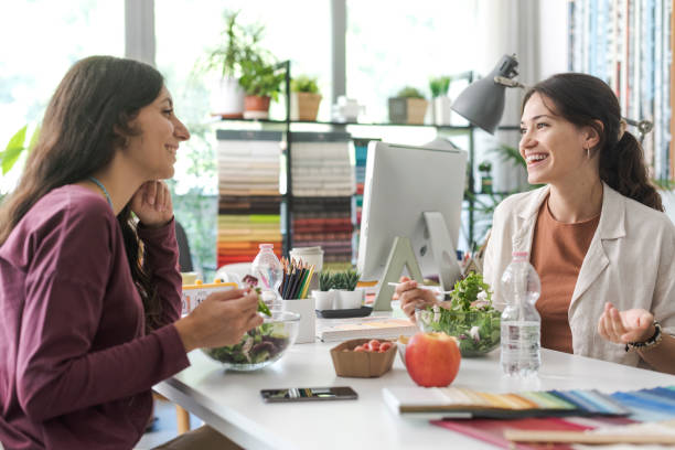 Women having a lunch break together
