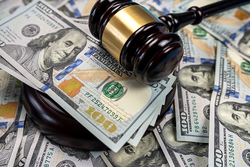 Gavel cash dollar bills and financial crimes. Justice on dollar bills and legal concept