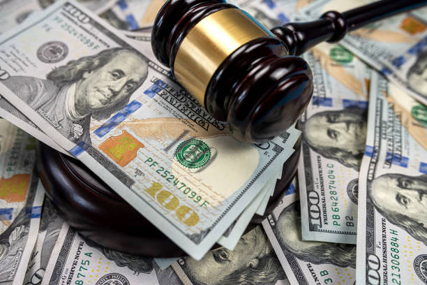 Gavel cash dollar bills and financial crimes. Gavel cash dollar bills and financial crimes. Justice on dollar bills and legal concept Punishment stock pictures, royalty-free photos & images
