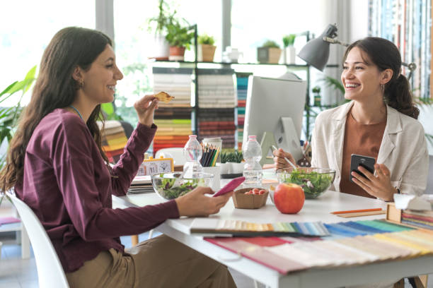 istock Women having a lunch break together 1441371483