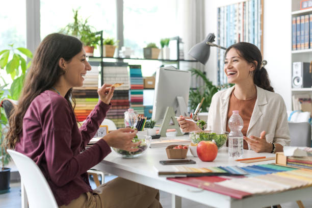istock Women having a lunch break together 1441371763