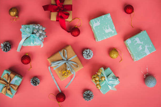 istock Small Christmas gifts on pink background 1441371969