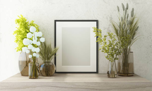 istock Mockup poster frame close up on light gray concrete cement wall with white flowers green leaf and surrounding by decoration mock up. 3D render 1441373007
