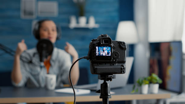 istock Close up shoot of professional camera recording vlogger talking to audience 1441373244
