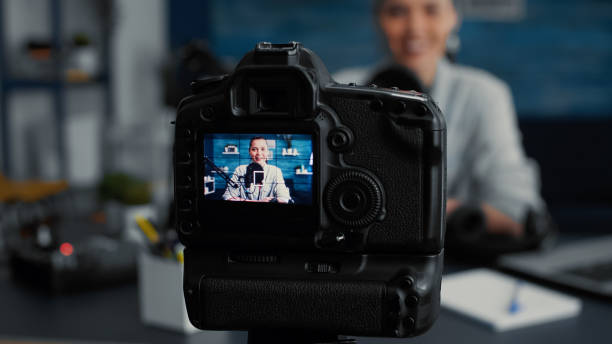 istock Professional camera recording social media influencer daily vlog while talking to audience 1441373769