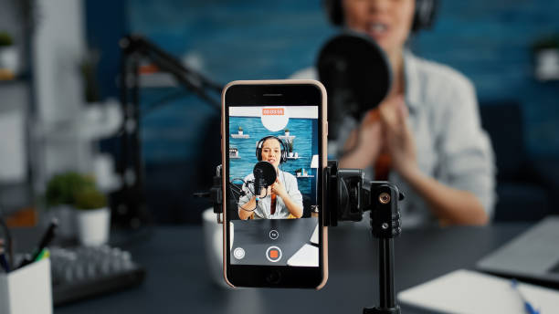 istock Modern smartphone recording vlogger talking to public 1441374476
