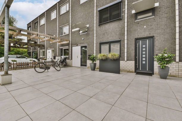 istock The facade of a small gray brick house 1441374748