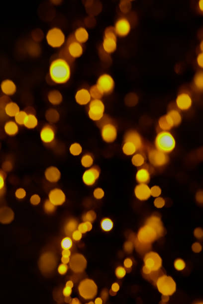 istock Abstract orange and gold dark background with glowing turquoise particles. 1441374877