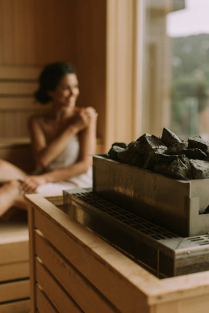 istock Young woman relaxing in the sauna 1441375188