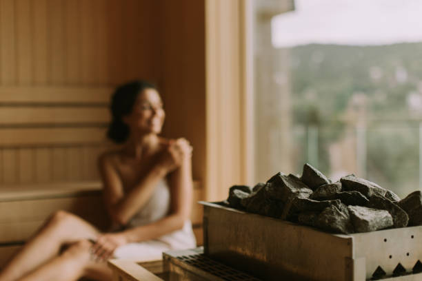 istock Young woman relaxing in the sauna 1441375575