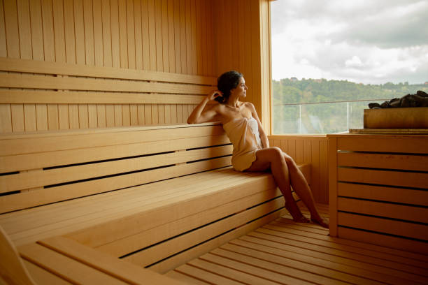 istock Young woman relaxing in the sauna 1441375583