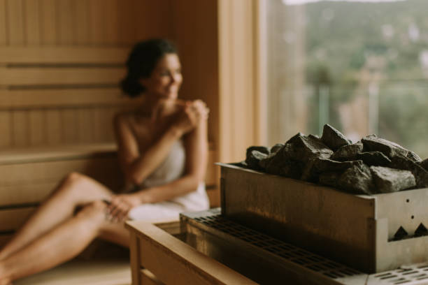istock Young woman relaxing in the sauna 1441375588