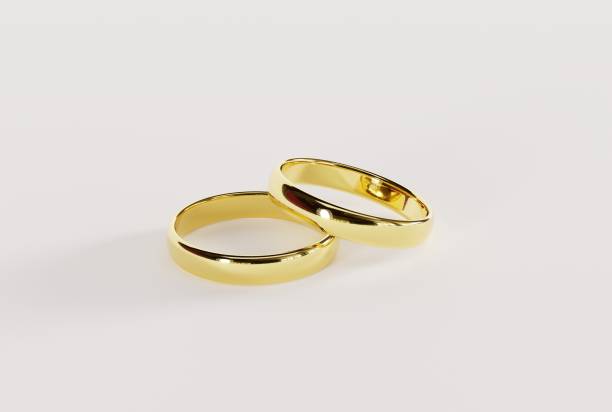 istock Gold wedding rings on a light background. 1441376492