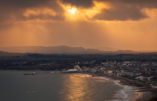 Stormy sunset view of Sandown seafront from Culver Down Isle of Wight south east England