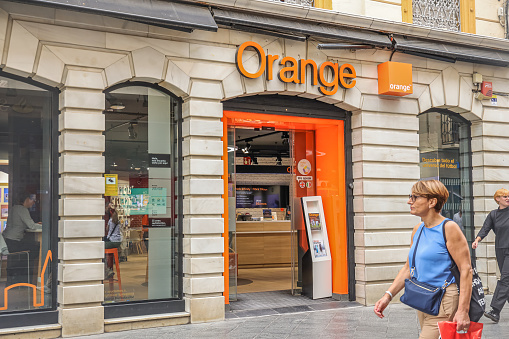 Seville, Spain- October 20,2022: The branch office of Orange S.A. in Seville.  Orange S.A. formerly France Télécom S.A. (stylized as france telecom) is a French multinational telecommunications corporation.