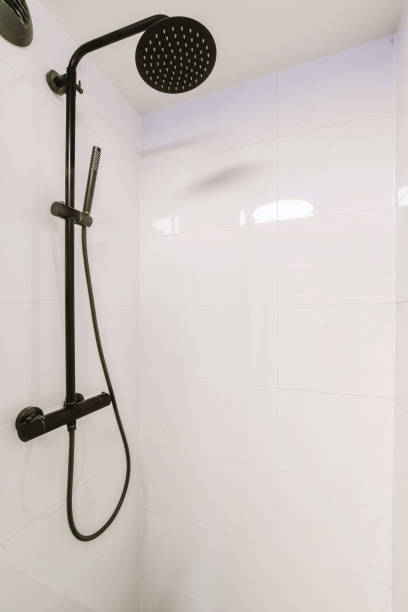 istock Bathroom interior with snow-white ceramic tiles 1441379351