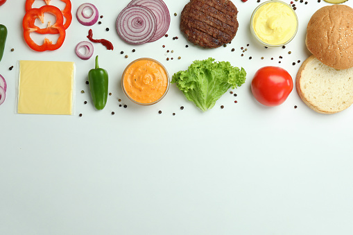 Concept of cooking burger on white background, top view