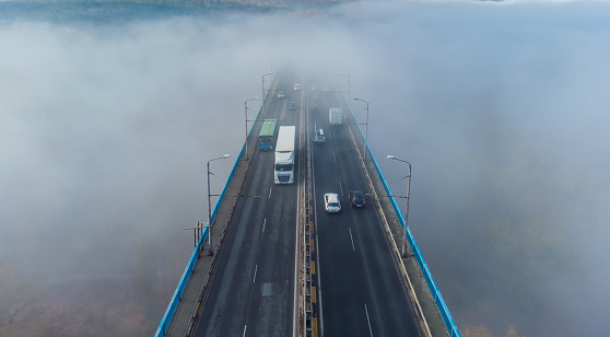 Aerial top view of the Asparuhov bridge in the fog in the morning, Varna, Bulgaria