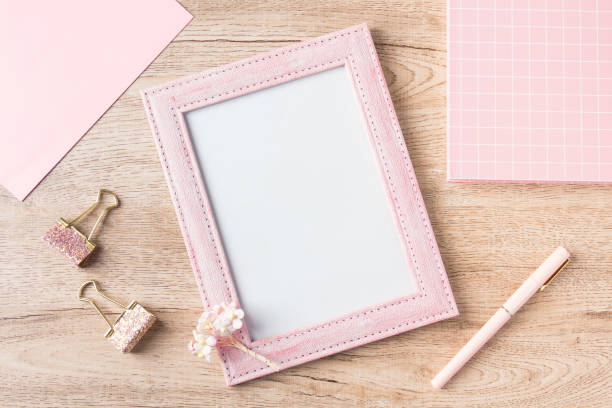 istock flat lay picture frame and stationery 1441384710