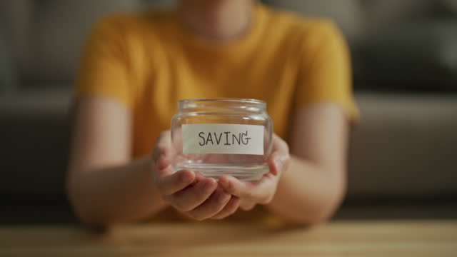 Woman showing empty jar saving