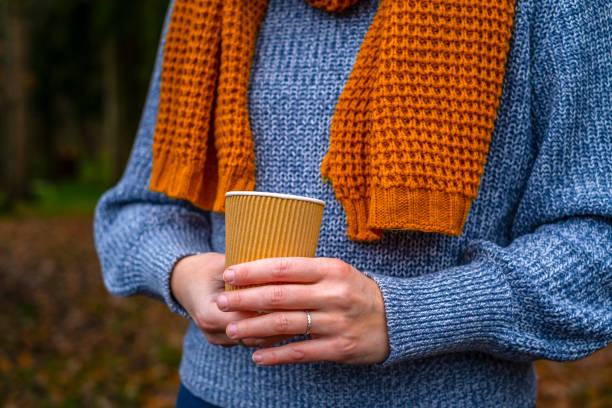 istock Cup coffee in hand in the woods 1441384957