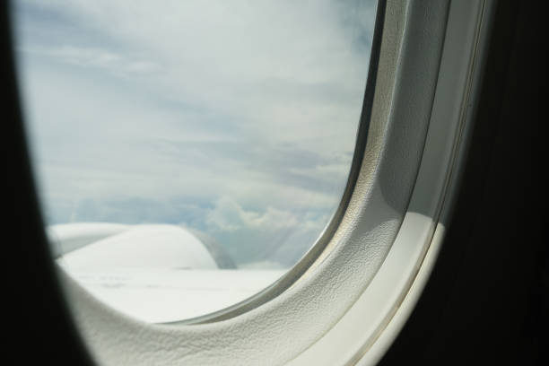 istock The aeroplane window with the cloud scene. 1441386455