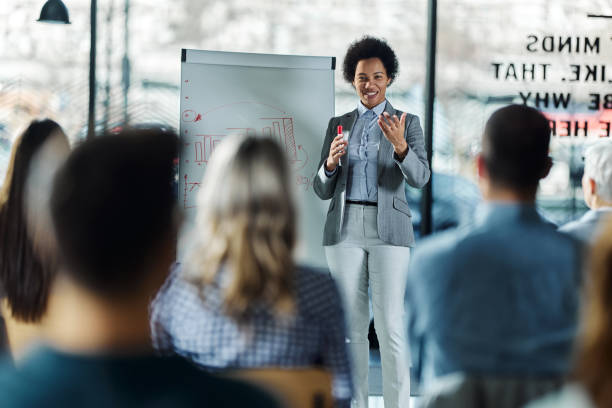 istock Happy black leader talking on presentation in the office. 1441388154