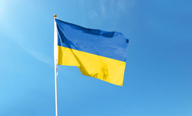 Ukrainian flag on cloudy sky. waving in the sky